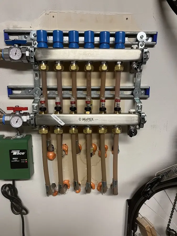 Plumber performing Water Heater Repair at a residential property in Geddes